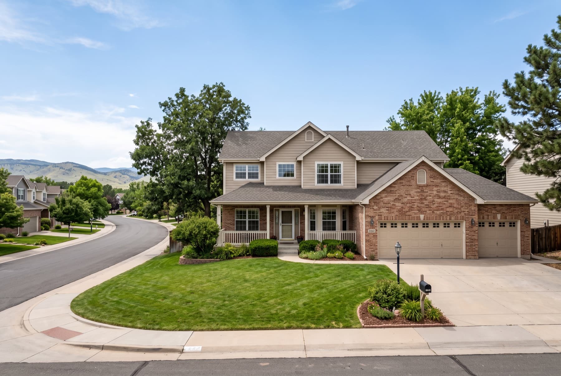 Two-story with a covered porch and a three-car garage, Arvada